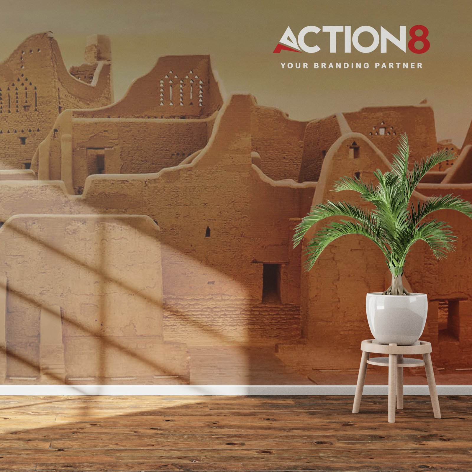Action8 branded wall display with a desert-themed backdrop and a potted plant in a modern interior setting.