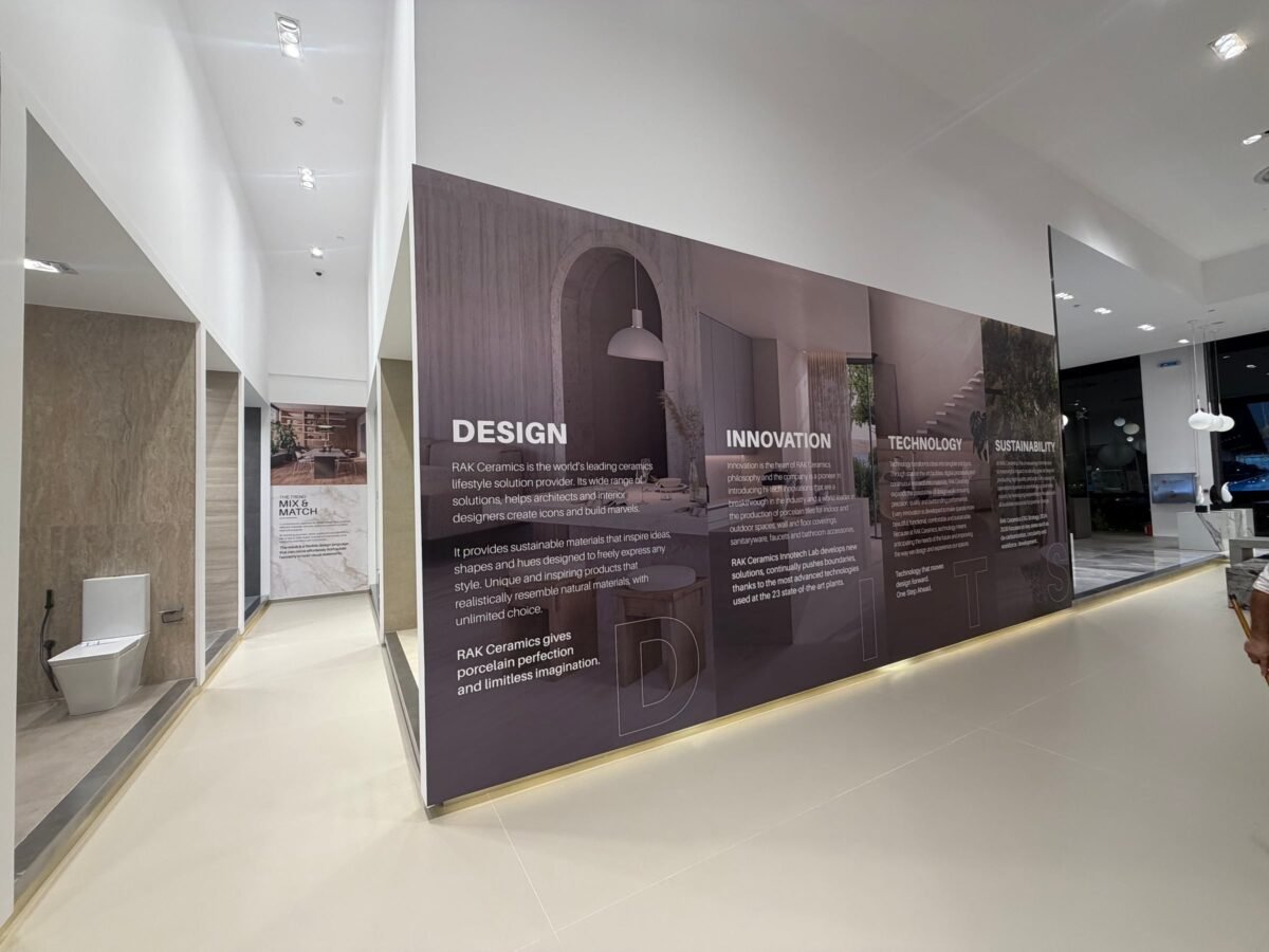 Action8 project: printed wall graphics running along the walkway of a showroom in Jeddah